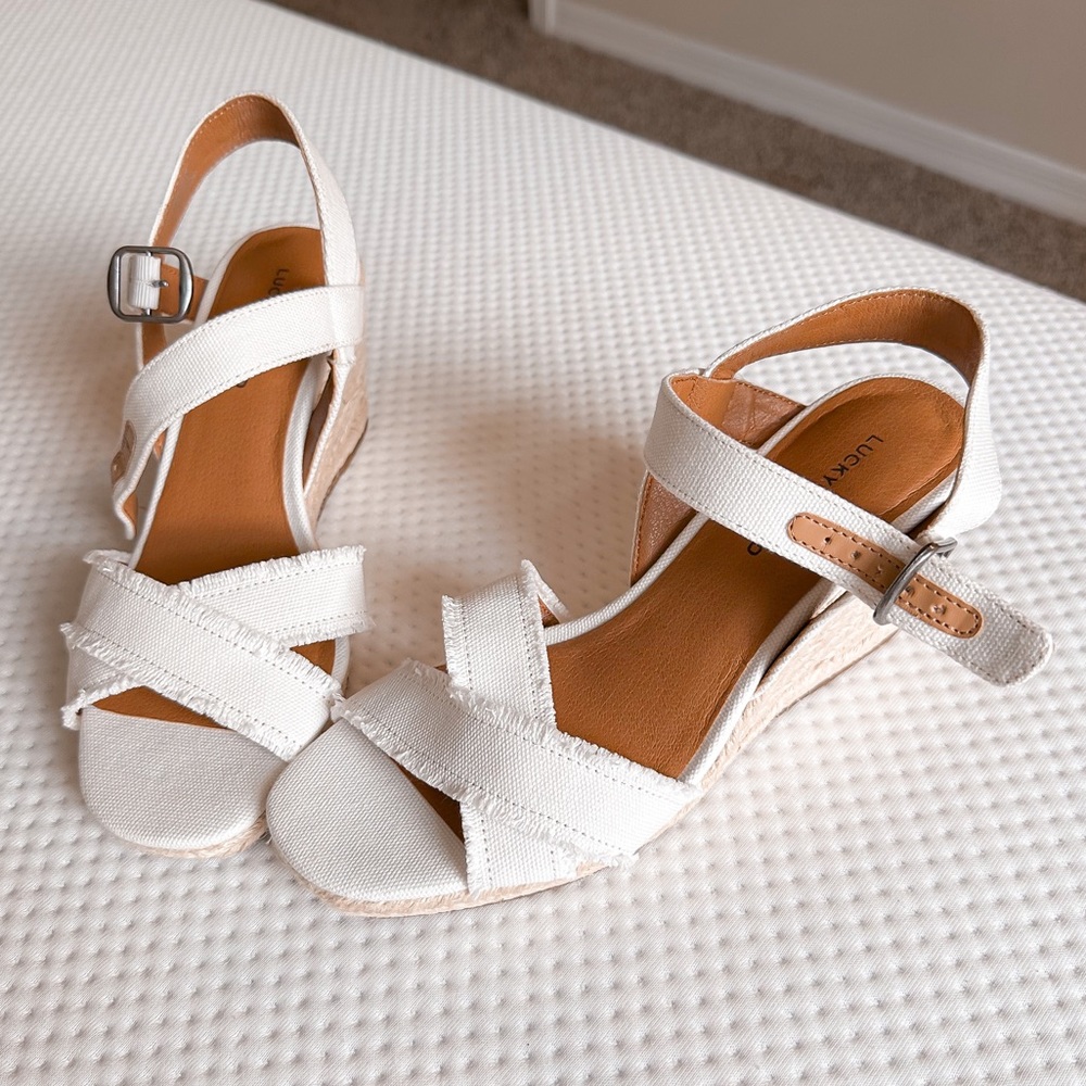 Women’s size 8 brand new, never worn lucky brand, wedge sandals color white